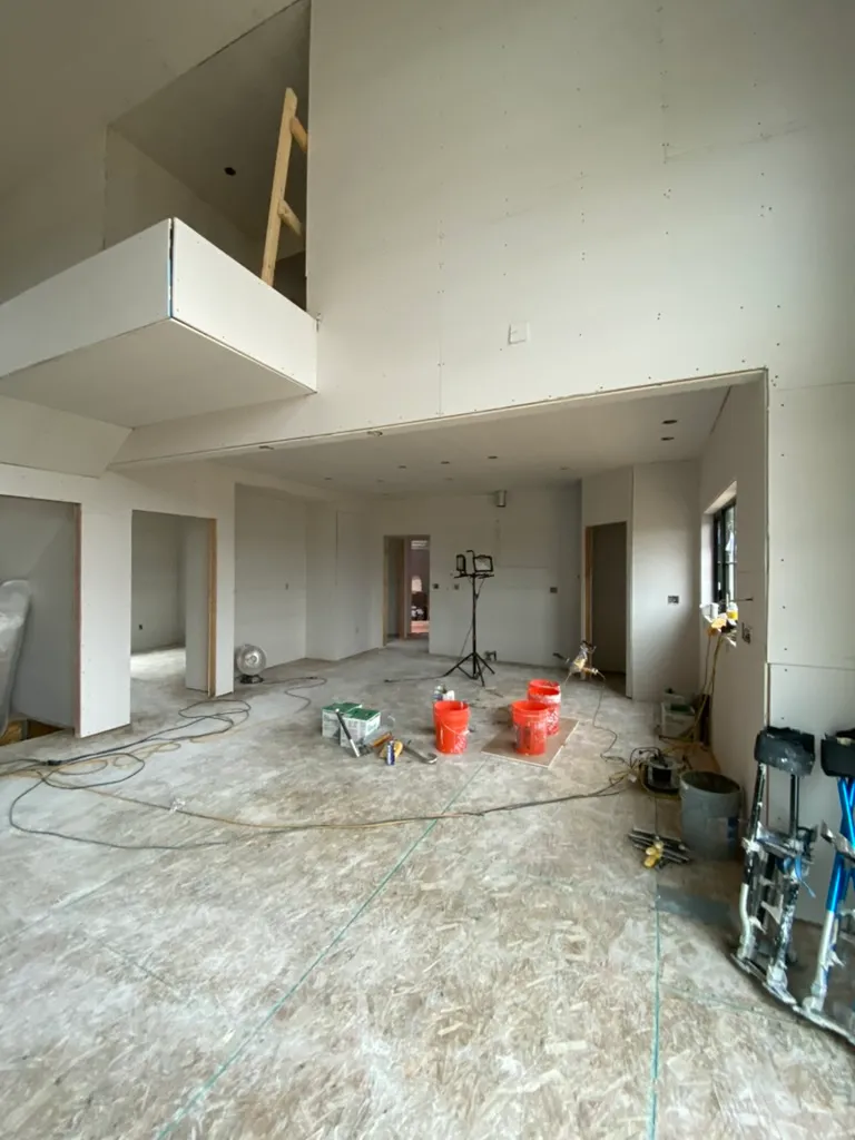 Open floor plan with new drywall hung